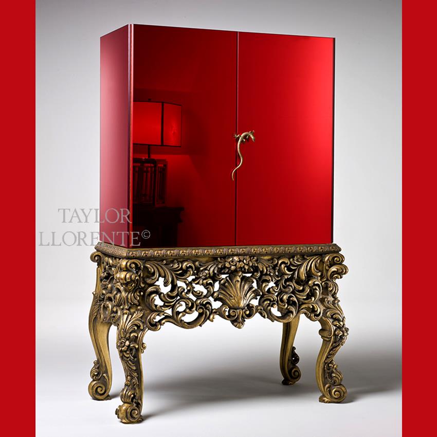 bar cabinet with red glass and carved gold legs