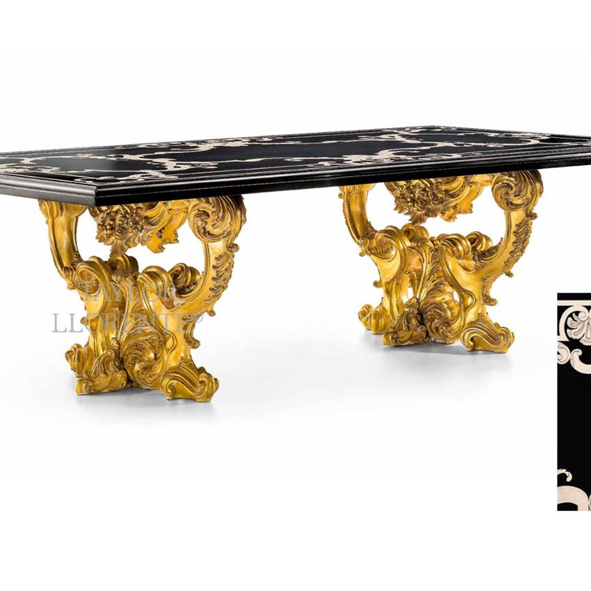 Carved baroque dining table finished in gold leaf.