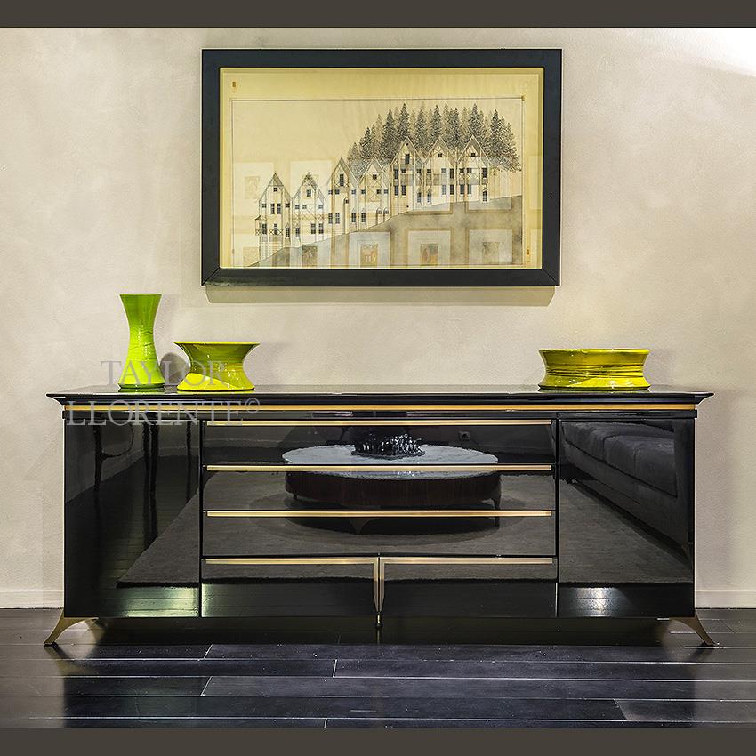 shiny black lacquered sideboard with brass metal detailing and feet
